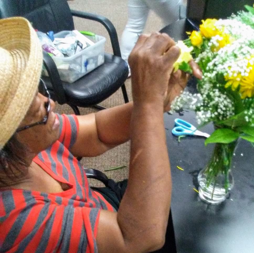 A client learns flower arranging. A client learns flower arranging.