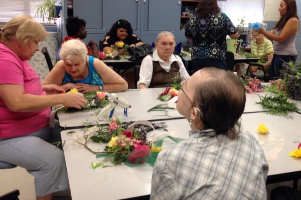 A client learns flower arranging. A client learns flower arranging.
