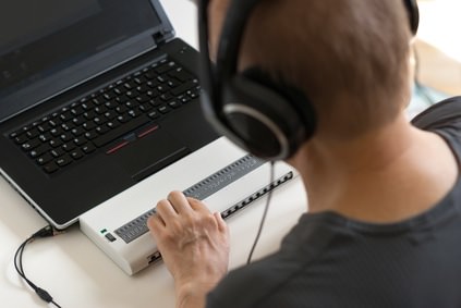 Child Reading Braille